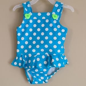 Blue polka dot one piece swimsuit with heart butto